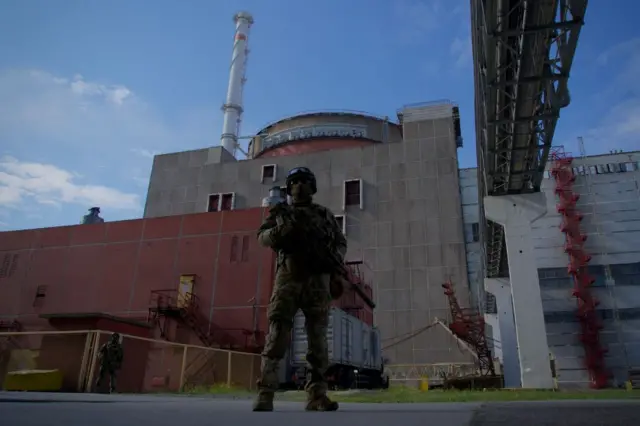 A Russian serviceman outside the Zaporizhzhia power plant