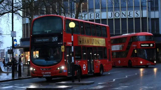 Buses pass through Sloane Square in west London