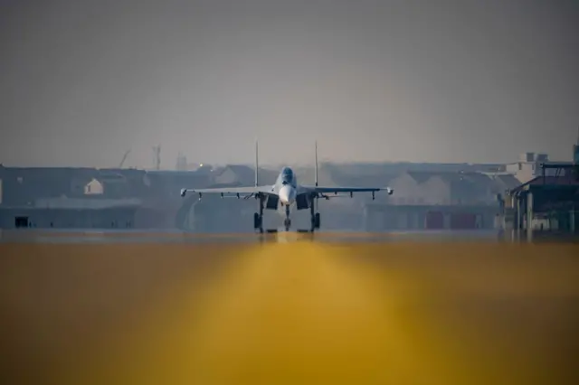 A Chinese J-16 taxis on the tarmac.