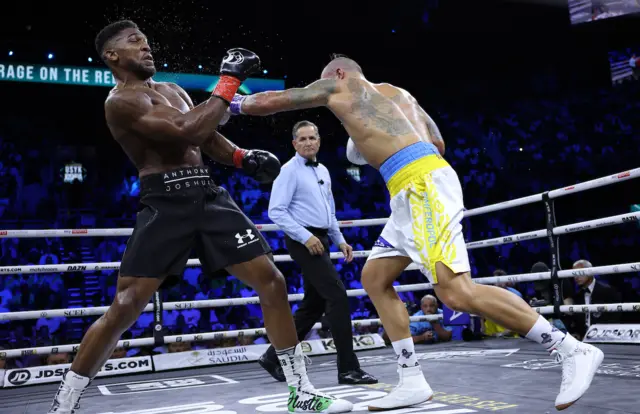 Anthony Joshua takes a hit from Oleksandr Uysk