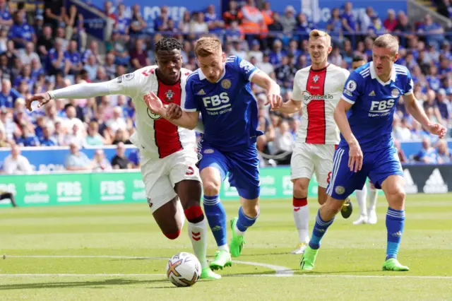 Harvey Barnes of Leicester City in action with Armel Bella-Kotchap of Southampton