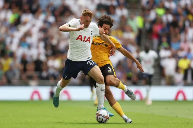 Dejan Kulusevski of Tottenham Hotspur battles for possession with Rayan Ait-Nouri of Wolverhampton