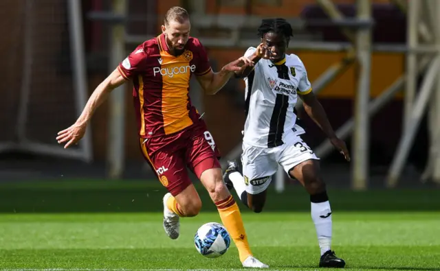 Motherwell's Kevin Van Veen holds off Livingston's Stephen Omeonga