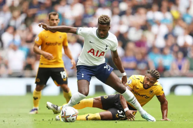 Ryan Sessegnon of Tottenham Hotspur is tackled by Adama Traore of Wolverhampton