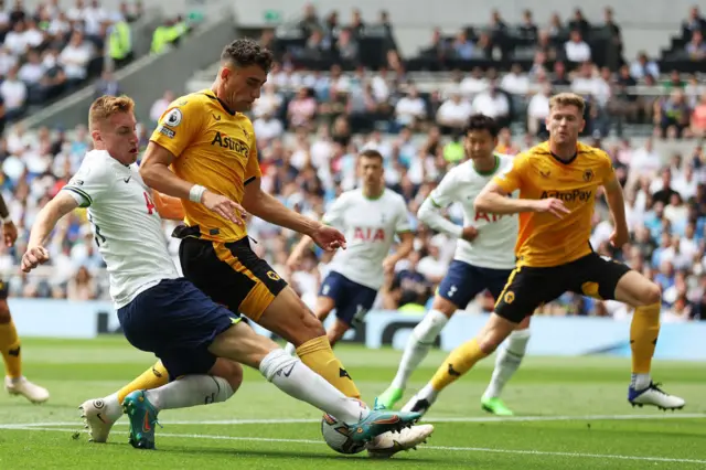 Dejan Kulusevski of Tottenham Hotspur battles for possession with Max Kilman of Wolverhampton