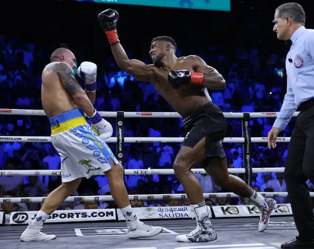 Anthony Joshua misses with an uppercut to Oleksandr Usyk