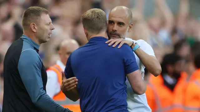 Pep Guadiola hugs Eddie Howe