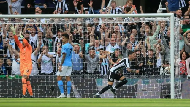 Miguel Almiron celebrates scoring for Newcastle