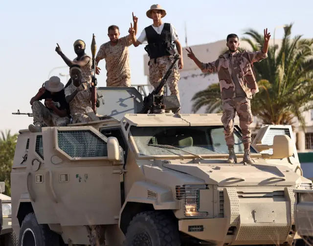 Joint forces affiliated with Libya's Government of National Unity assemble inside the closed Tripoli International Airport, as they deploy on the outskirts and entrances of the capital Tripoli on 25 July. At least 16 people were killed and 52 wounded in fighting between armed groups in Tripoli, the health ministry said on 23 July, following the latest politically driven violence to hit the Libyan capital.