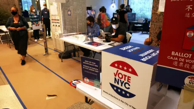 People vote in a polling station in a residential building in New York's 12th Congressional District on August 23, 2022 in New York City