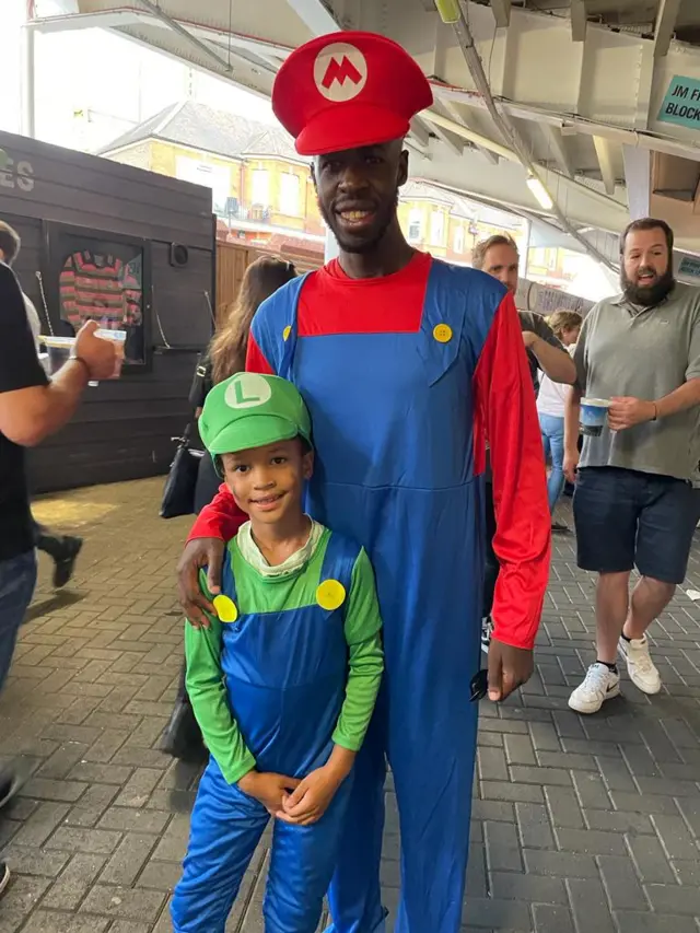 Two cricket fans at The Oval dressed as Mario and Luigi