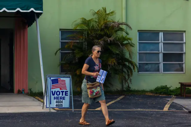 A woman votes in Florida