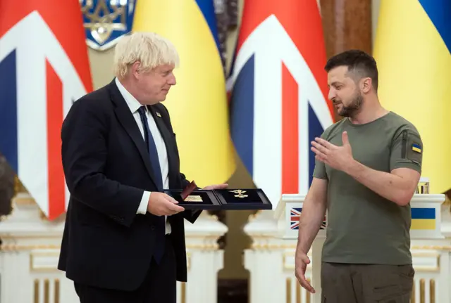 Boris Johnson olds the Order of Liberty as he speaks to Zelensky