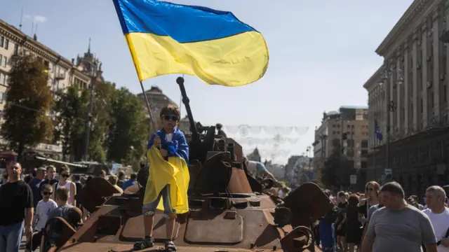 People visit an exhibition of destroyed Russian military vehicles and weapons in Kyiv