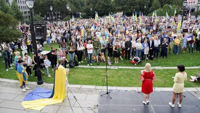 People take part in a demonstration against the Russian war in Ukraine at Eidsvolls plass in Oslo, Norway