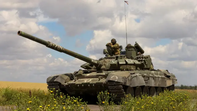 An armoured convoy of Russian troops drives in Ukraine's Zaporizhzhia region