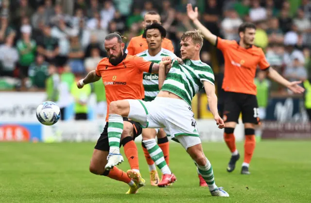 Steven Fletcher and Carl Starfelt tussle