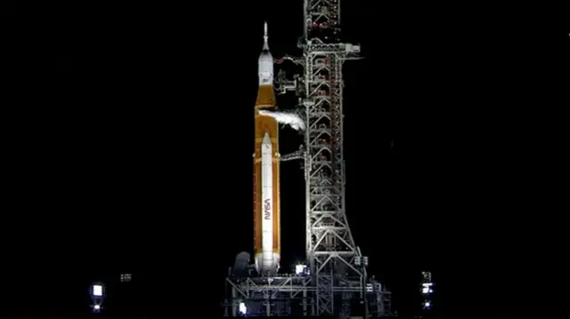 The Space Launch System prepares for lift-off on the launch pad