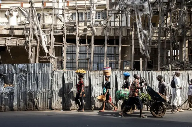 People walking on the street in Freetown