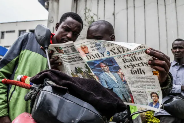 Boda-boda riders read newspapers with the headline of Raila Odinga's rejection on the outcome of the presidential election in Nakuru Town.