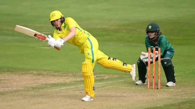 Australia batter Tahlia McGrath hits a four in her team's Commonwealth Games match against Pakistan