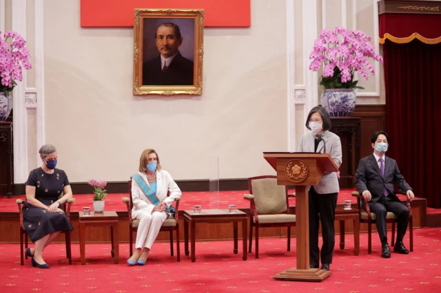 U.S. House Speaker Nancy Pelosi watches Taiwan President Tsai Ing-wen speak at a meeting in the presidential office in Taipei