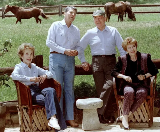 FILE PHOTO: File photo showing former Soviet leader Michail Gorbachev and his wife Raisa (R) with former U.S. President Ronald Reagan and his wife Nancy, at the Reagan ranch in the Santa Ynez mountains near Santa Barbara on May 3, 1992.