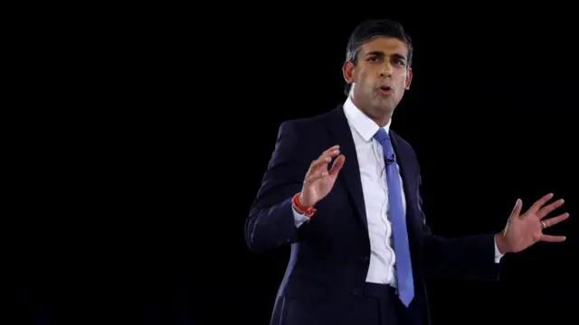 Rishi Sunak on stage at the hustings