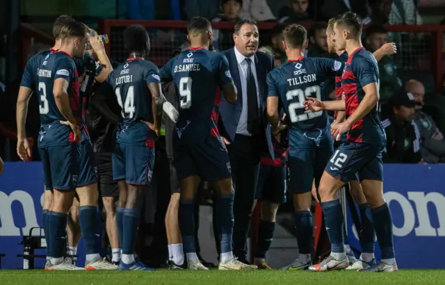 Malky Mackay talks to his Ross County players