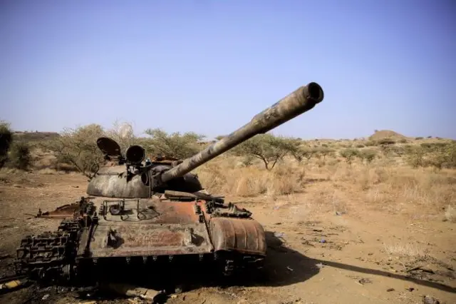 A destroyed tank is seen in a field in the aftermath of fighting between the Ethiopian National Defence Force (ENDF) and the Tigray People's Liberation Front (TPLF) forces in Kasagita town, in Afar region, Ethiopia, February 25, 2022.