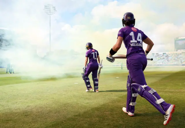 Alyssa Healy and Laura Wolvaardt walking out to bat