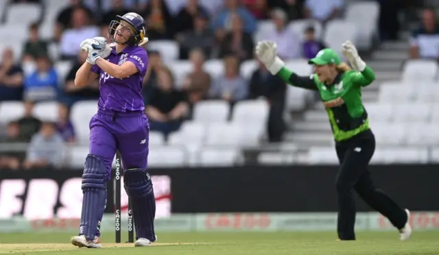 Alyssa Healy looking frustrated after being caught out by Sophia Dunkley