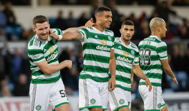 Giorgos Giakoumakis (second left) celebrates his goal