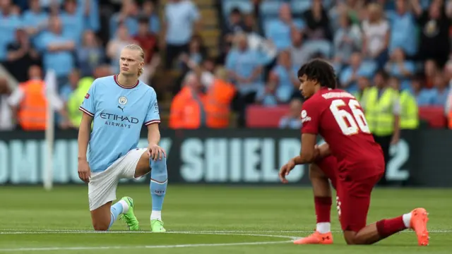 Erling Haaland and Trent Alexander-Arnold take a knee