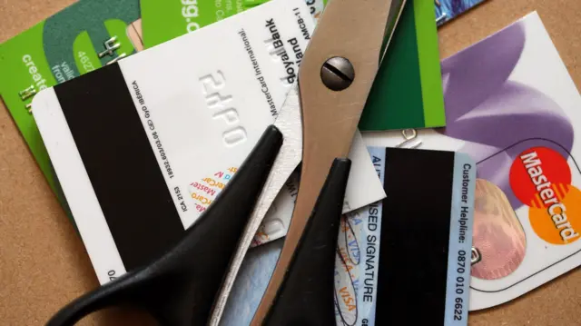 credit cards and a pair of scissors