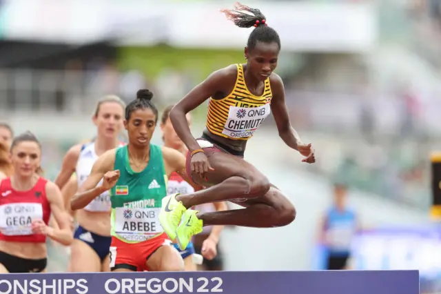 Uganda's Peruth Chemutai jumps a hurdle in the Olympic 3,000m steeplechase