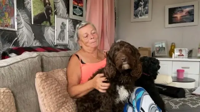 Lucy Cogle at home with her dogs