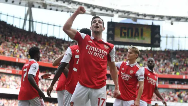 Cedric Soares (centre) celebrates