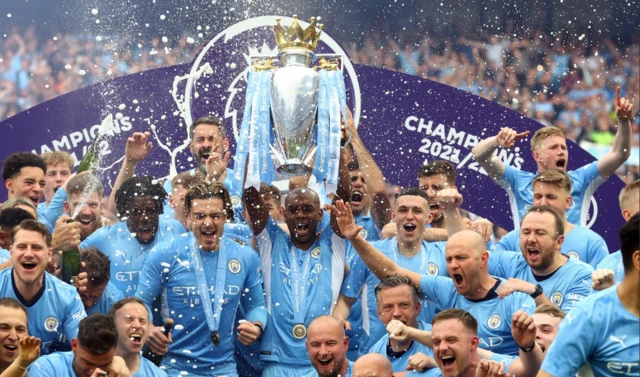 Manchester City lift the Premier League trophy in 2022