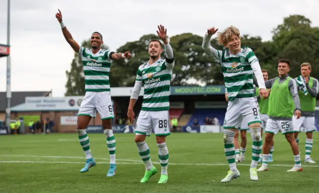 Celtic players celebrate with their fans at full-time