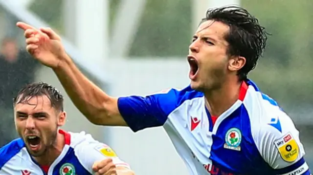 Lewis Travis celebrates his screamer for Blackburn