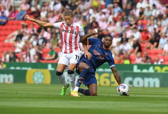 Dwight Gayle battles for possession