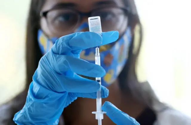 A medic prepares to give the monkeypox vaccine.