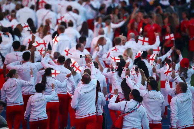 England athletes waving flags