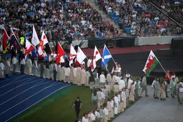 Flags are brought into the stadium
