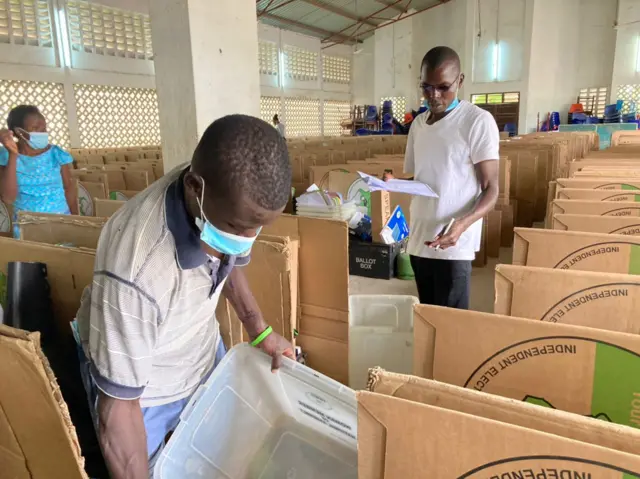 Polling station workers get voting materials ready.