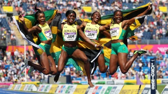 Jamaica's women's 4x100m relay team celebrate at the Commonwealth Games