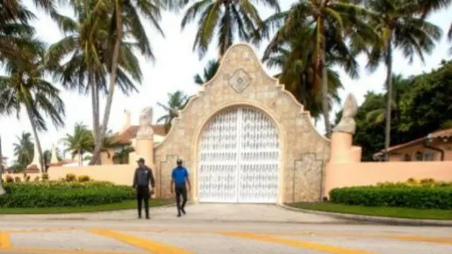 Security guards walk outside Mar-a-Lago, the residence of former president Donald Trump, amid reports of the FBI executing a search warrant as a part of a document investigation, in Palm Beach, Florida, USA,