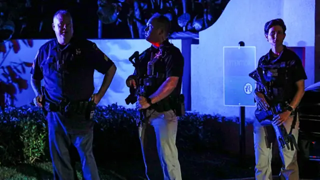 Secret service members stand guard outside former US President Donald Trump's Mar-a-Lago home