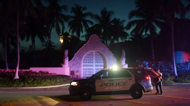 Mandatory Credit: Photo by JIM RASSOL/EPA-EFE/REX/Shutterstock (13078406d) Authorities stand outside Mar-a-Lago, the residence of former president Donald Trump, amid reports of the FBI executing a search warrant as a part of a document investigation, in Palm Beach, Florida, USA, 08 August 2022. The FBI raids former US President Donald Trump's Mar-a-Lago residence, Palm Beach, USA - 08 Aug 2022